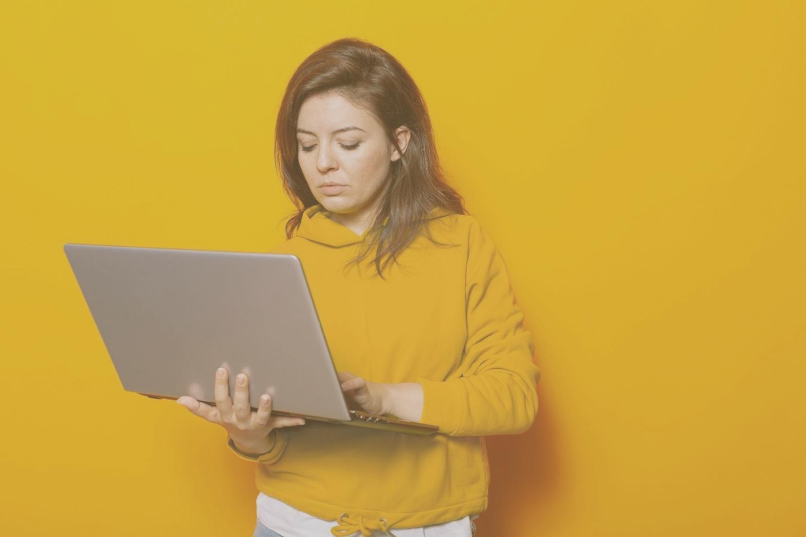 Programmer analyzing code architecture and design patterns on dual monitors